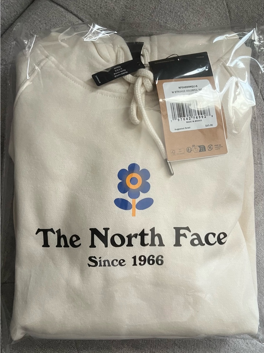The North Face Cream Hoodie with Blue & Orange Floral Graphic